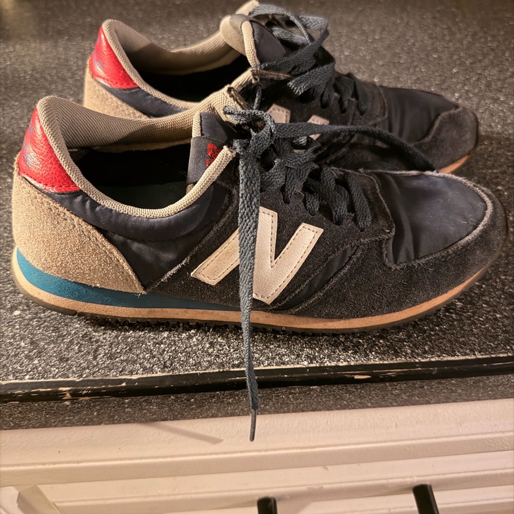 New Balance Black and Red Sneakers with Blue and White Accents